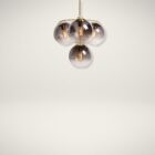 Sunpan Kamara Chandelier with four smoked glass globe shades and a brushed gold frame.