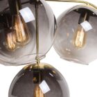 Sunpan Kamara Chandelier with four smoked glass globe shades and a brushed gold frame.
