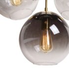 Sunpan Kamara Chandelier with four smoked glass globe shades and a brushed gold frame.