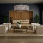 Sunpan Kore Large Smoke Grey Chandelier with cylindrical smoked glass rods and a brushed silver frame.
