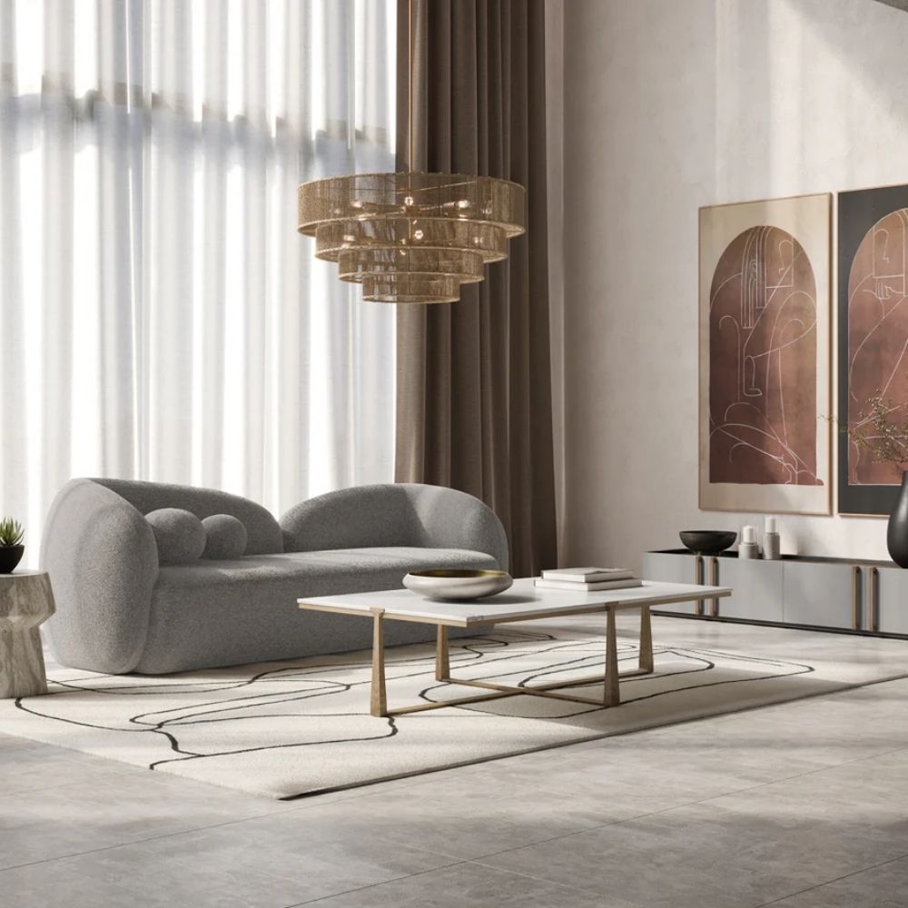Tiered chandelier with cascading concentric rings wrapped in natural jute string and suspended from a gold rod and canopy.