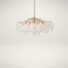 Uttermost Boreas Chandelier with cascading clear glass accents on a sculptural gold branch-like frame.