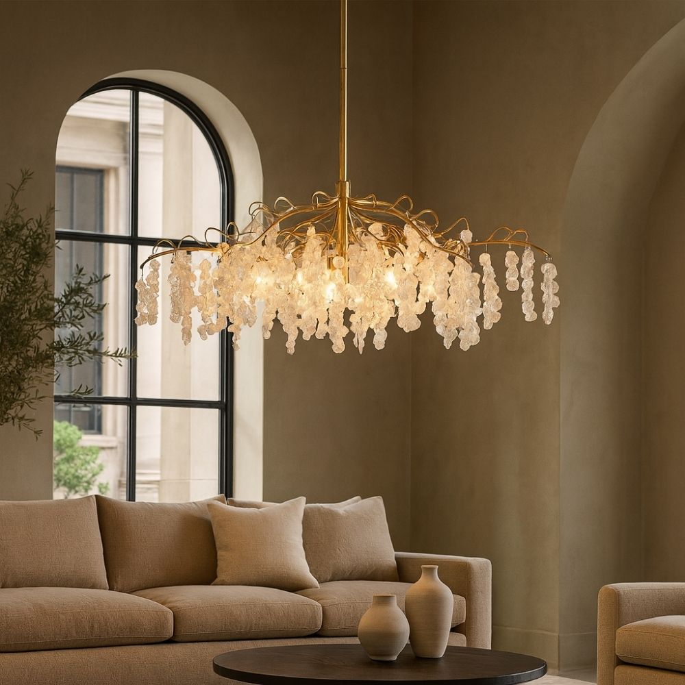 Uttermost Boreas Chandelier with cascading clear glass accents on a sculptural gold branch-like frame.