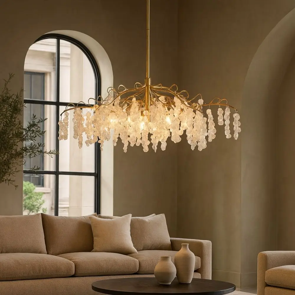 Uttermost Boreas Chandelier with cascading clear glass accents on a sculptural gold branch-like frame.