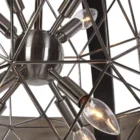 Uttermost Polaris Chandelier with a spherical black iron frame, brushed silver band, and starburst inner light design.