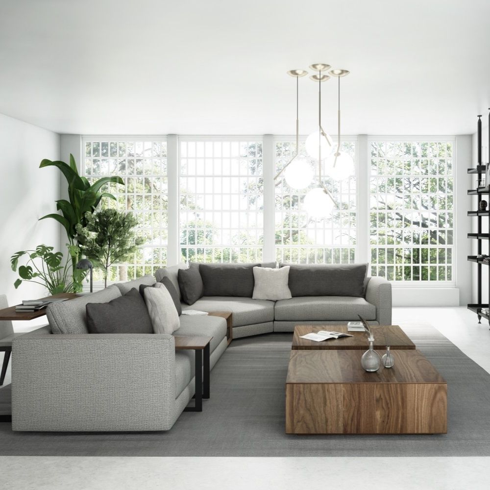A modern modular sectional sofa in neutral beige with a built-in walnut storage table and chaise lounge.