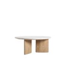 Round coffee table with a white stone top and sculptural blonde wood base in an intersecting design.