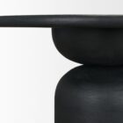 Modern round black dining table with sculptural pedestal base and smooth wood finish.