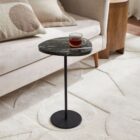 Renwil Adeline Accent Table with round black marble top and slim black metal pedestal base.