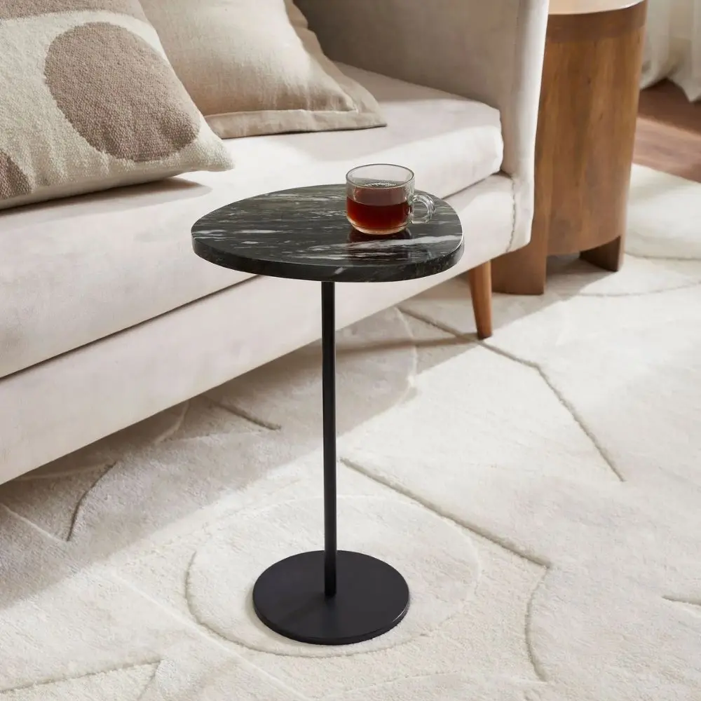 Renwil Adeline Accent Table with round black marble top and slim black metal pedestal base.
