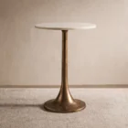 A round side table with a smooth white marble top and antique brass pedestal base, featuring a modern yet timeless silhouette.