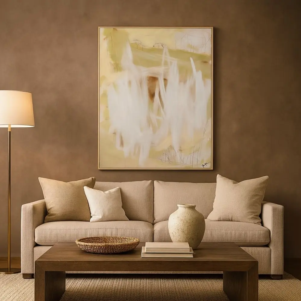 Abstract wall art featuring soft earthy tones of beige, cream, and muted green with expressive white brushstrokes, framed in a slim profile.