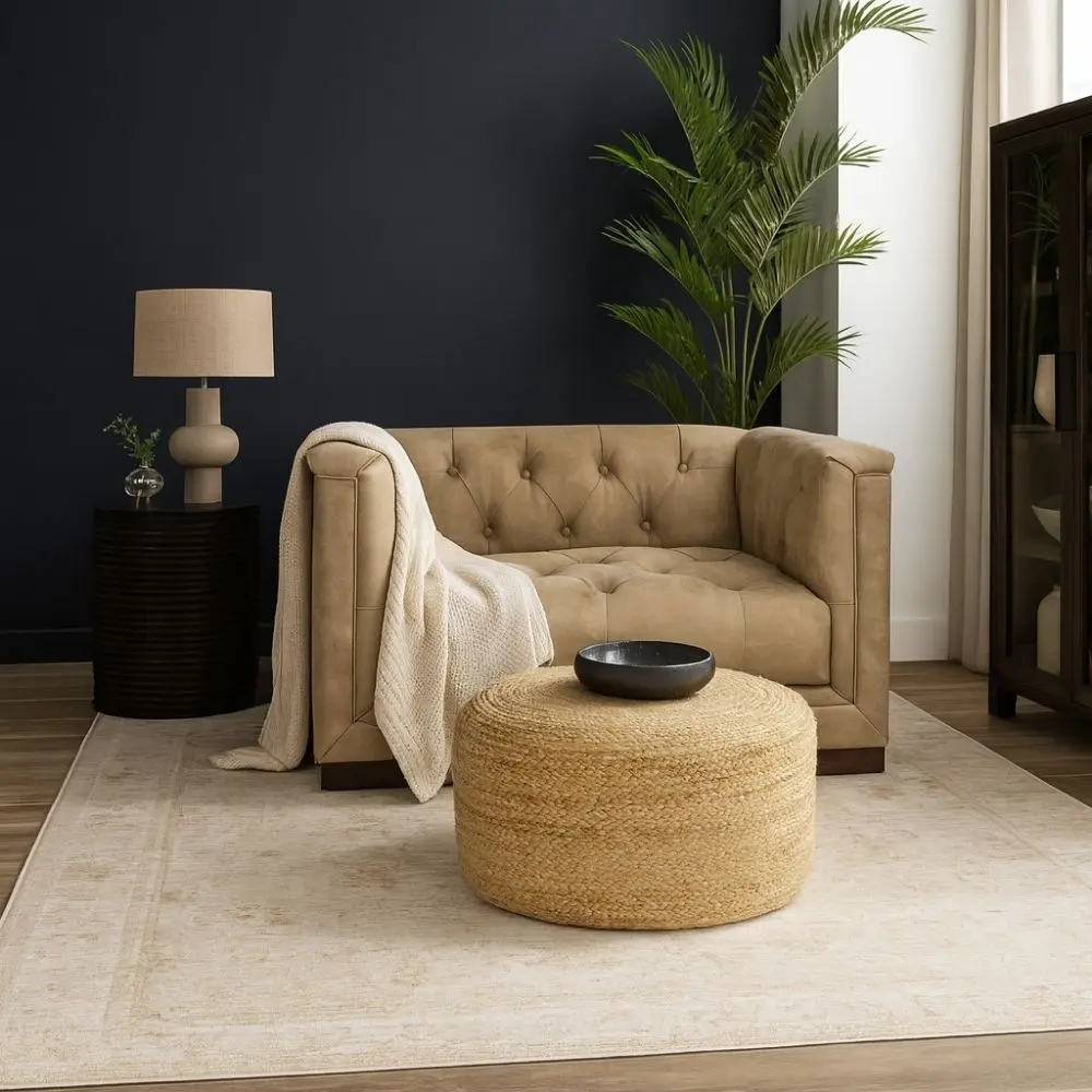 Round woven pouf in natural jute fiber with a casual, textured look.