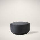 Renwil Colum Ottoman with oversized round silhouette upholstered in deep charcoal fabric.