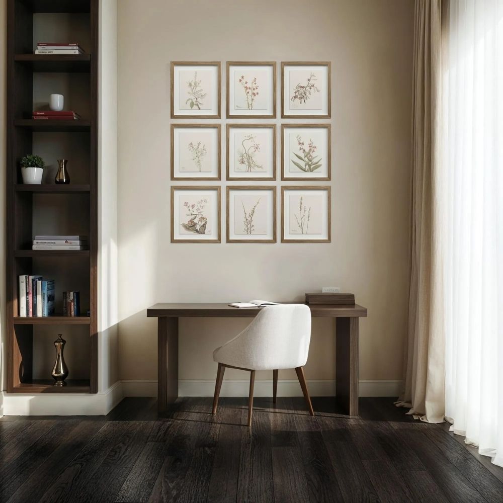 A set of nine framed botanical prints featuring delicate floral illustrations in muted tones, each with a natural wood frame arranged in a grid layout.