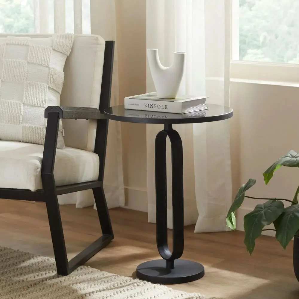 Renwil Eryx Accent Table with round black top and open geometric pedestal base in matte black metal.