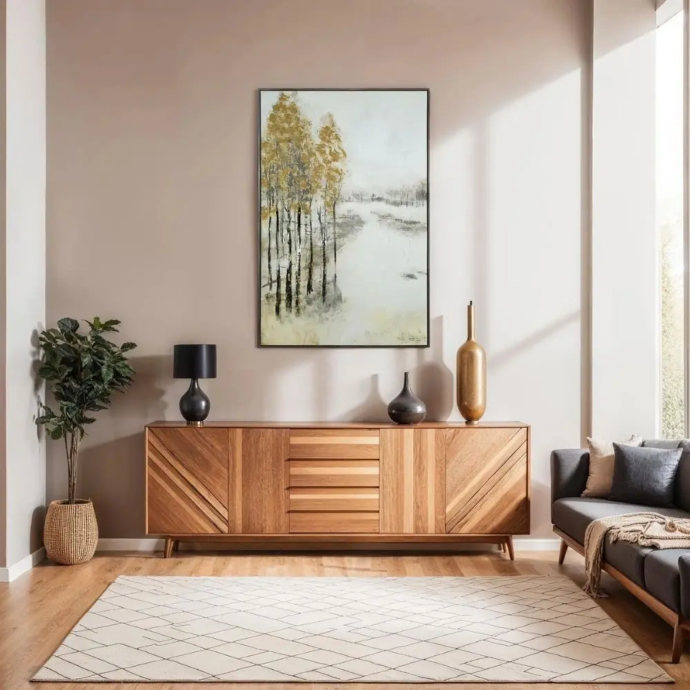 A vertical wall art piece featuring tall slender trees with golden foliage contrasted against a misty white and grey background.