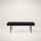 Modern black upholstered bench with slim tapered legs.
