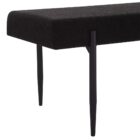 Modern black upholstered bench with slim tapered legs.