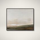 A contemporary landscape wall art piece featuring soft neutral tones of beige, cream, and earthy greens, framed in a slim black frame.