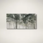 A nature-inspired wall art piece depicting tall trees with dark green foliage fading into a misty, neutral-toned background.