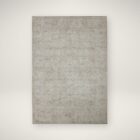 Light grey distressed rug with subtle tonal pattern and vintage-inspired texture.