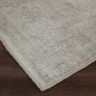 Light grey distressed rug with subtle tonal pattern and vintage-inspired texture.