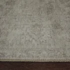 Light grey distressed rug with subtle tonal pattern and vintage-inspired texture.