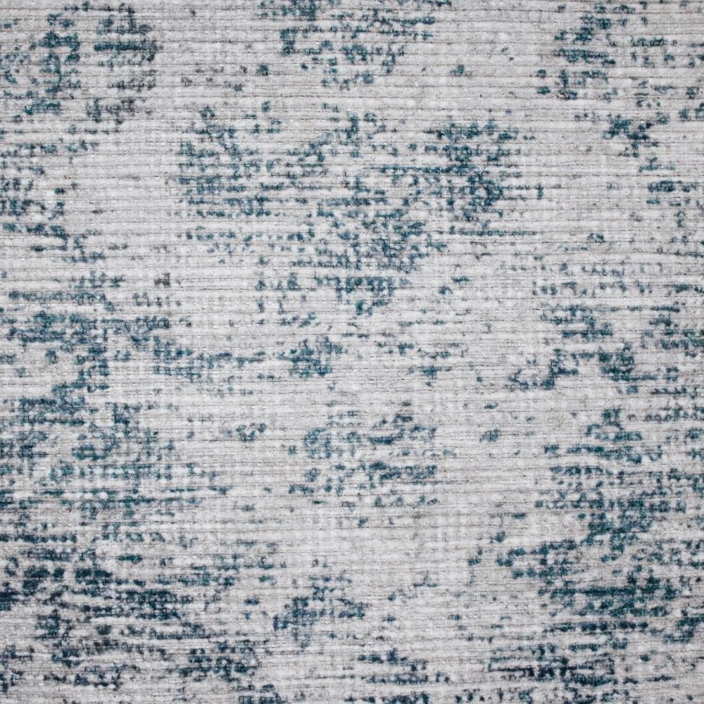 Light blue and ivory distressed rug with vintage-inspired medallion and border design.