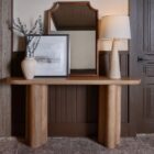 Vintage-inspired rug in muted brown, taupe, and soft blue with ornate medallion and border design.