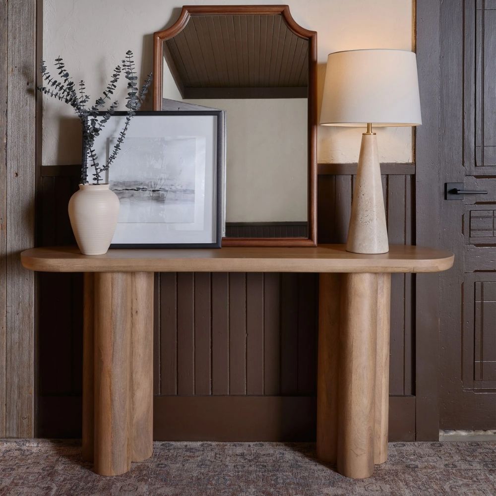 Vintage-inspired rug in muted brown, taupe, and soft blue with ornate medallion and border design.