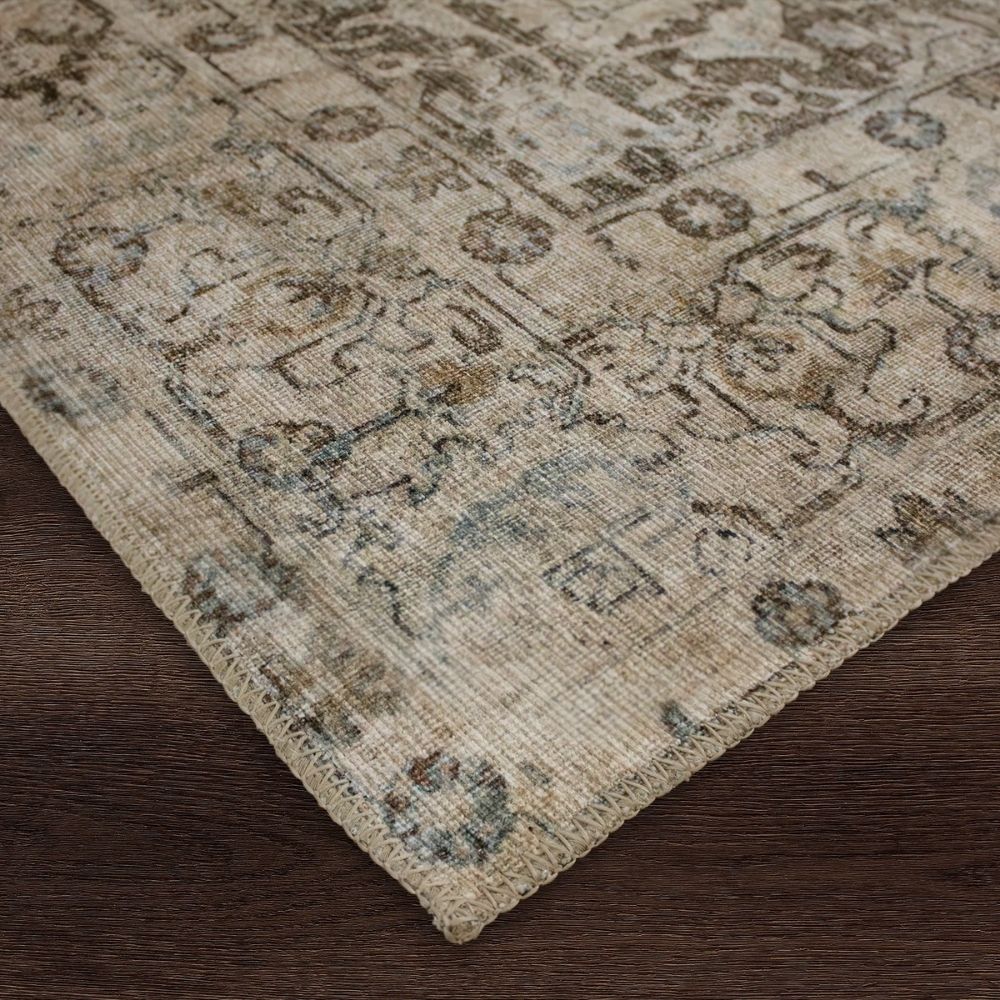 Distressed vintage rug in earthy taupe, beige, and soft grey with ornate medallion and border pattern.