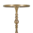 A round brass side table with a sculpted pedestal base and raised edge, featuring an antique finish and elegant silhouette.