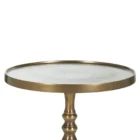 A round brass side table with a sculpted pedestal base and raised edge, featuring an antique finish and elegant silhouette.