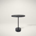 A modern black side table with a round top, slim central support, and cylindrical base in a minimalist design.
