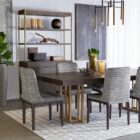 Contemporary dark wood bookcase with gold frame, three open shelves, and storage cabinet.