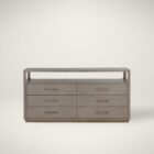 A modern greige six-drawer dresser with clean lines, slim metal hardware, and a smooth wood finish.