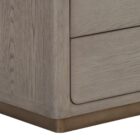 A modern greige six-drawer dresser with clean lines, slim metal hardware, and a smooth wood finish.
