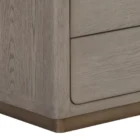 A modern greige six-drawer dresser with clean lines, slim metal hardware, and a smooth wood finish.
