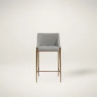 Modern counter stool with grey textured fabric seat and back, slim bronze-finished metal legs, and built-in footrest.