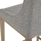 Modern counter stool with grey textured fabric seat and back, slim bronze-finished metal legs, and built-in footrest.
