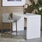 Modern counter stool with grey textured fabric seat and back, slim bronze-finished metal legs, and built-in footrest.