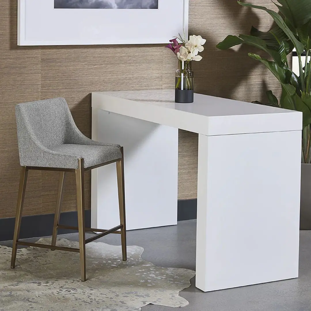 Modern counter stool with grey textured fabric seat and back, slim bronze-finished metal legs, and built-in footrest.