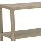 Low-profile wooden bookcase with open shelving in a natural oak finish.