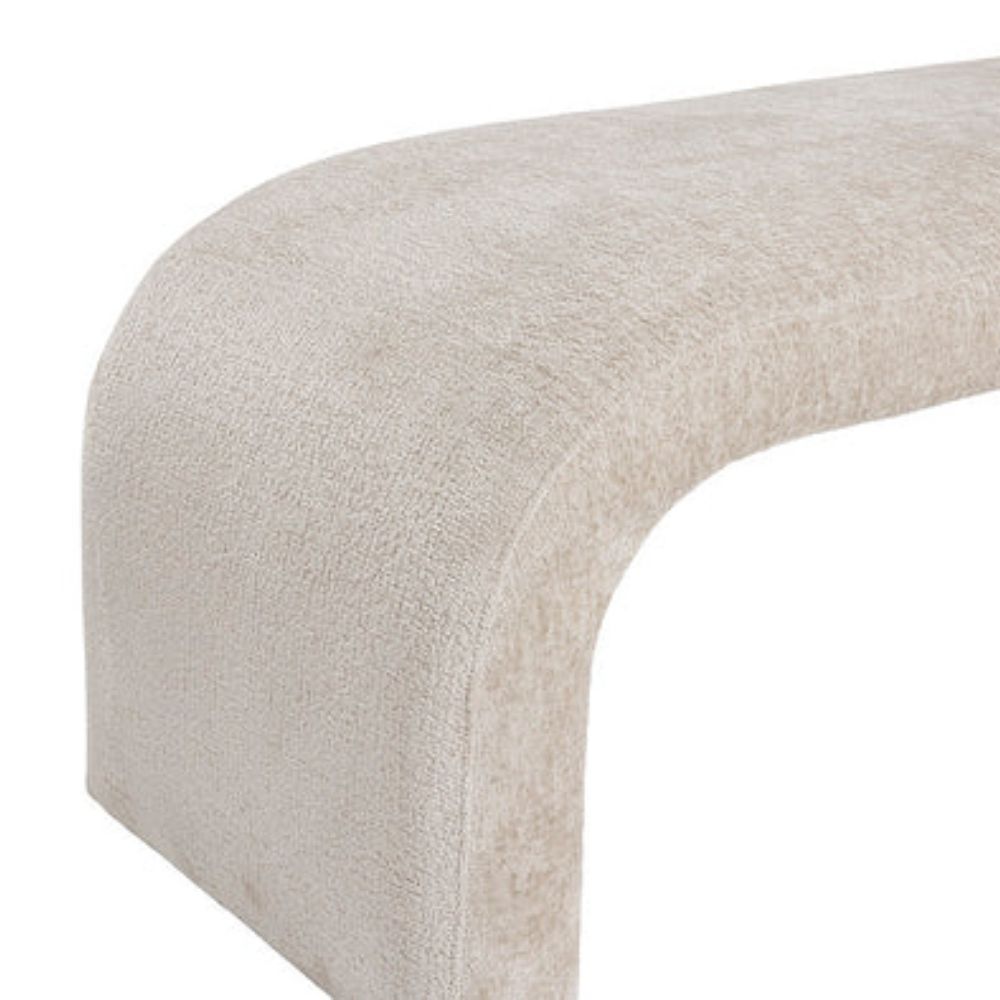 Curved taupe upholstered bench with seamless modern silhouette and low-profile design.