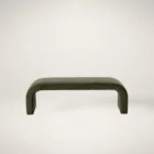 Modern curved green upholstered bench with seamless silhouette and low profile design.
