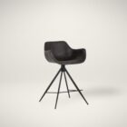 Modern swivel counter stool with black faux leather seat, curved arms, and black metal spider-leg base.