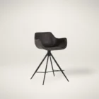 Modern swivel counter stool with black faux leather seat, curved arms, and black metal spider-leg base.