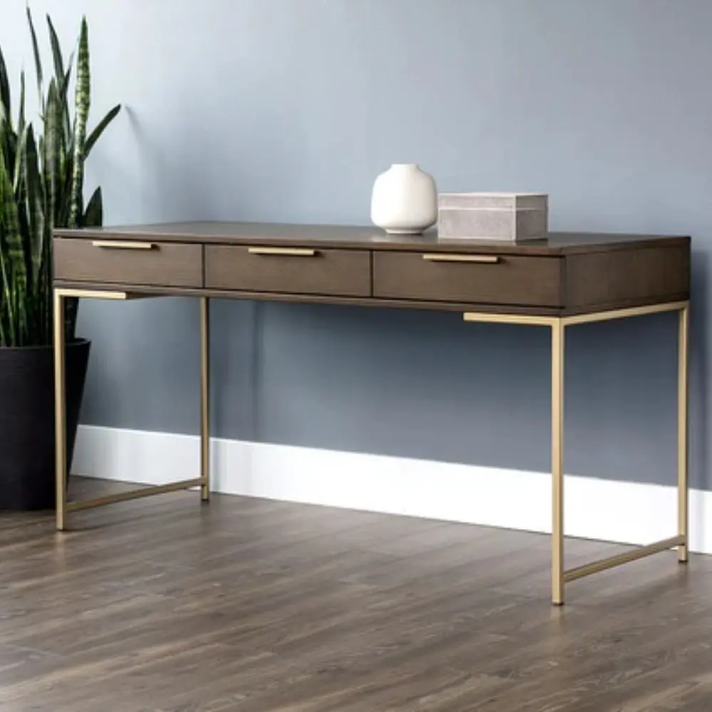 Modern wood desk with slim gold metal frame and three drawers.
