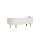 White upholstered bench with slim curved backrest and tapered gold-finished legs.